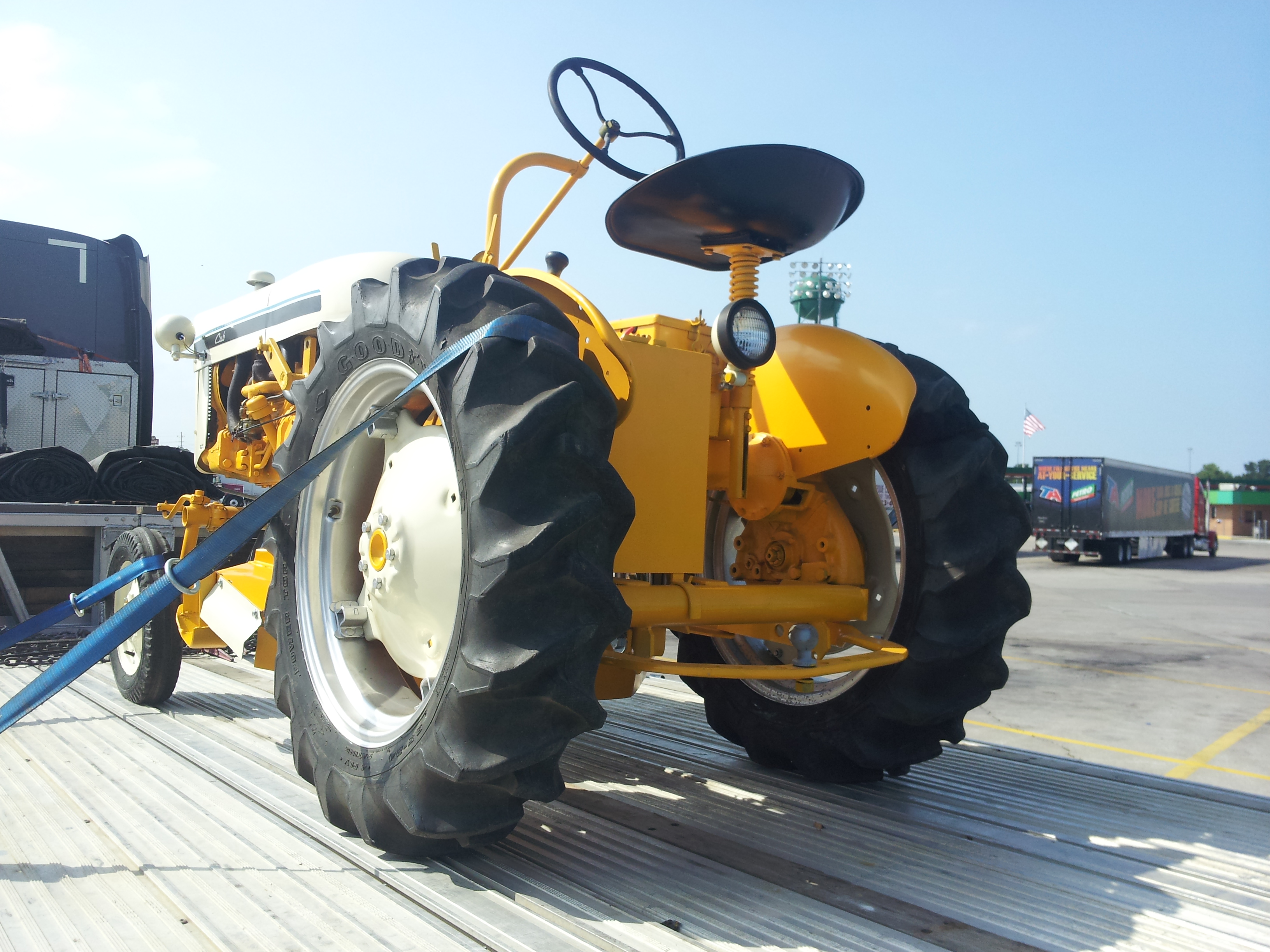 Tractor loaded on trailer for nationwide transport